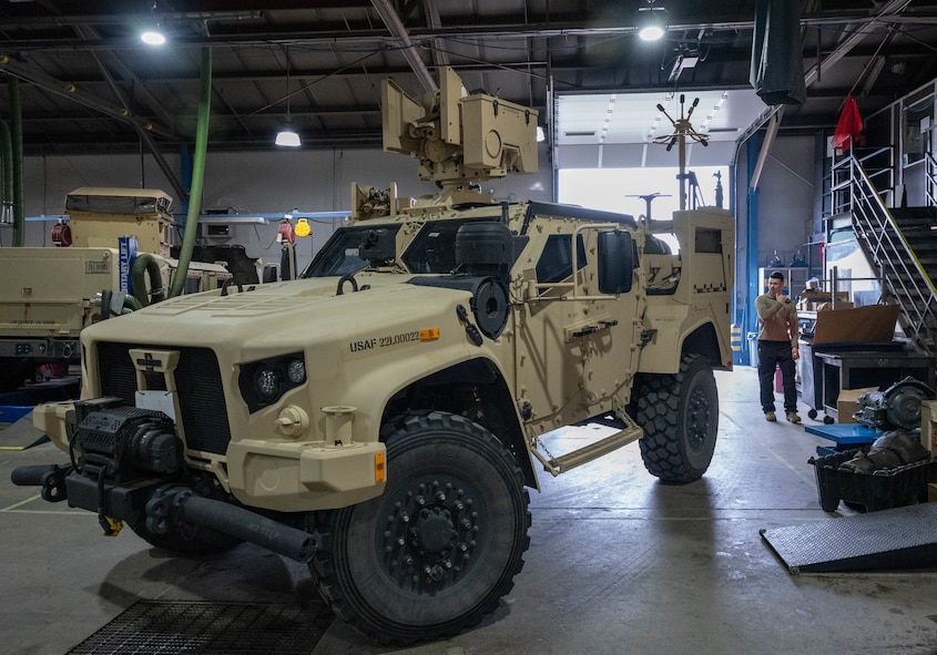 An Airman assigned to the 5th Logistics Readiness Squadron vehicle maintenance flight moves a Joint Light Tactical Vehicle (JLTV) into position for maintenance at Minot Air Force Base, North Dakota, April 30, 2025. The JLTV can be considered an improved version of the High Mobility Multipurpose Wheeled Vehicle (Humvee) with better armor, agility, and fuel efficiency plus a greater payload capacity. (U.S. Air Force photo by Airman 1st Class Wesley Davies)