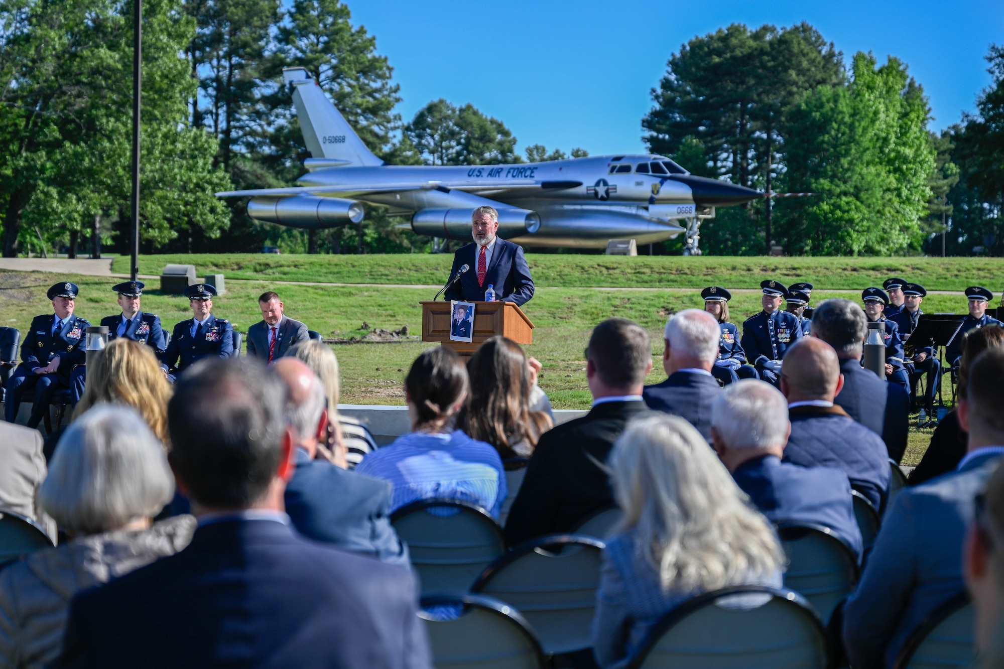 A man speaks to an audience from behind a podium.
