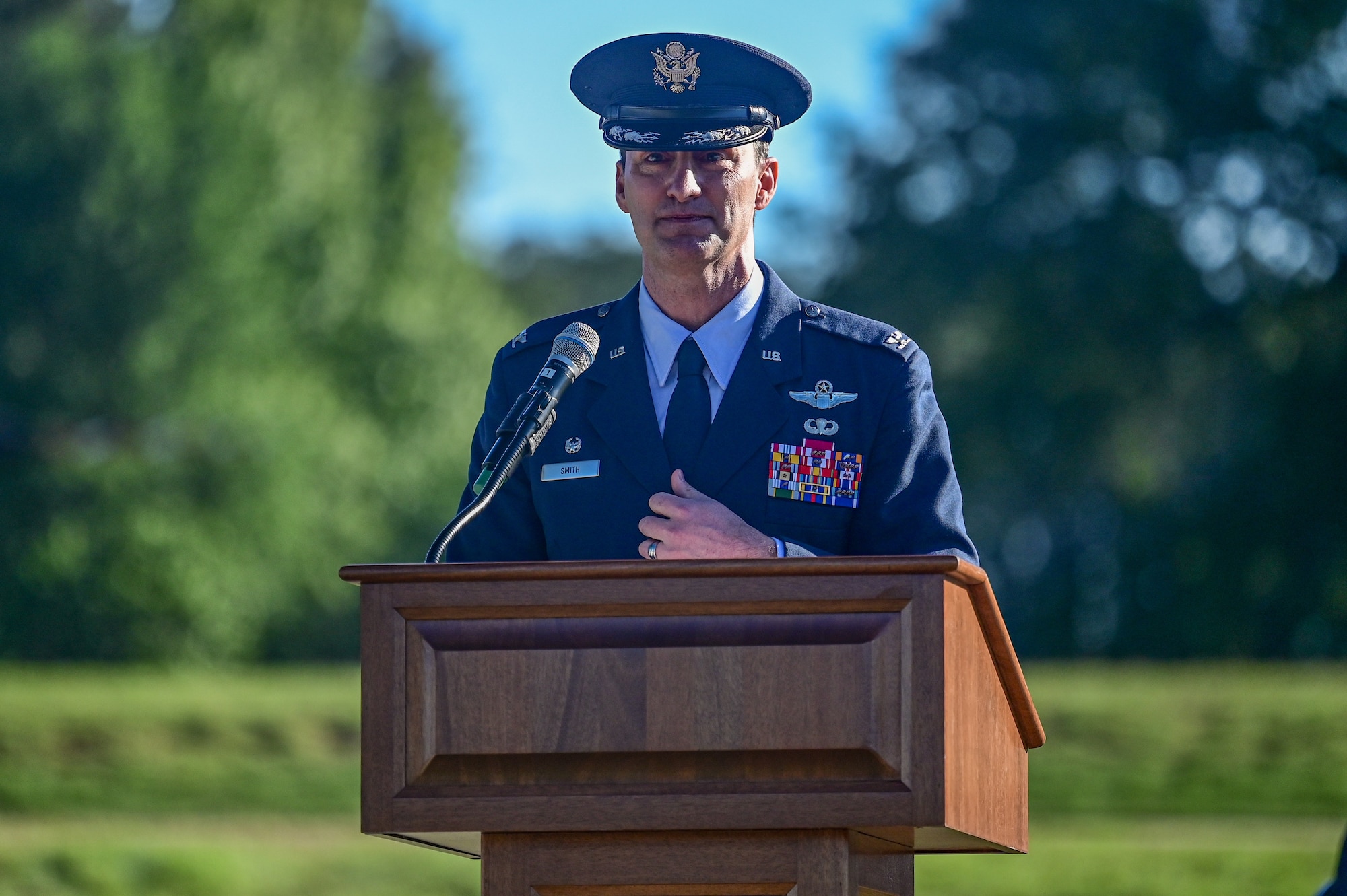 An Airman speaks behind a podium.