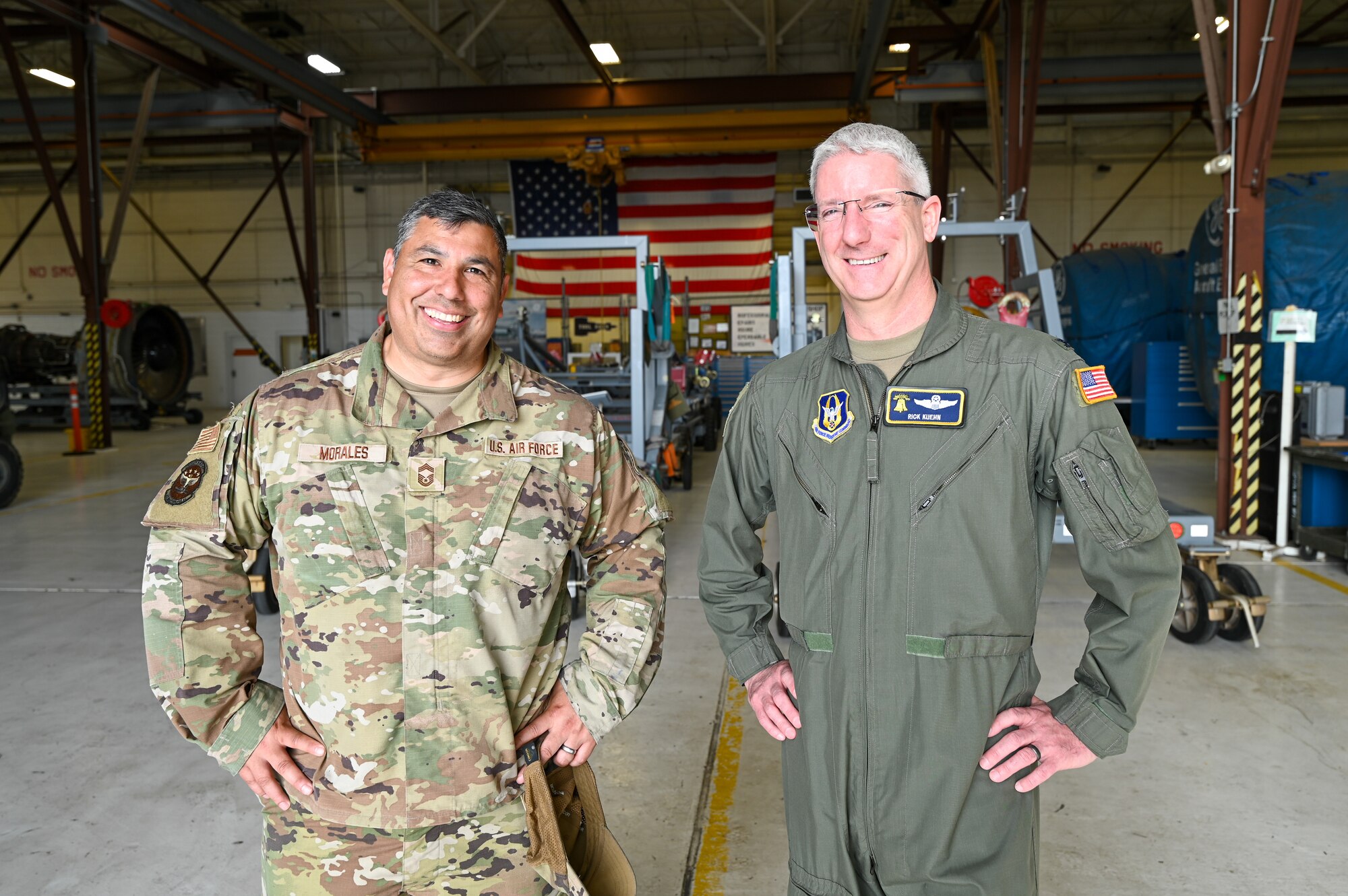Col. Rick Kuehn, 512th Airlift Wing deputy wing commander, and Chief Master Sgt. Geoffrey Morales, 512th AW senior leader, pose for a photo during a tour of the maintenance on a C-5M Super Galaxy at the 433rd AW on Joint Base San Antonio-Lackland, Texas April 25, 2025.