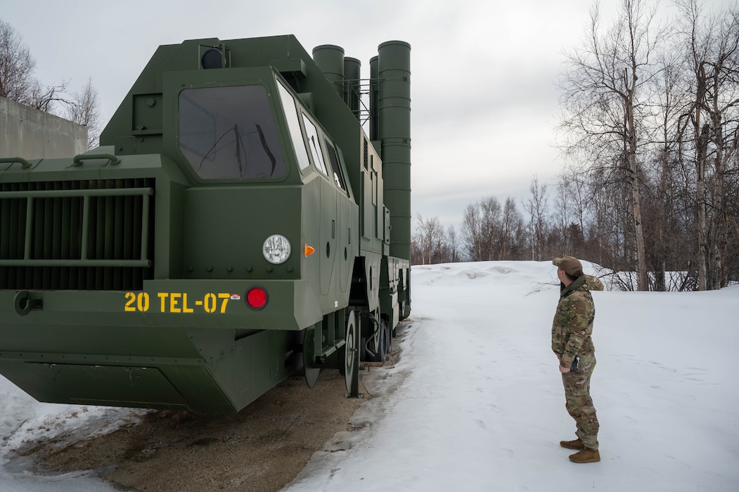 U.S. Air Force Staff Sgt. Kjell Olson, 354th Range Squadron plans and programs non-commissioned officer, inspects a range target at Eielson Air Force Base, Alaska, April 16, 2025.