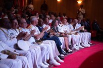 Distinguished visitors and senior participants react to a musical performance at the opening ceremony of Obangame Express 2025.
