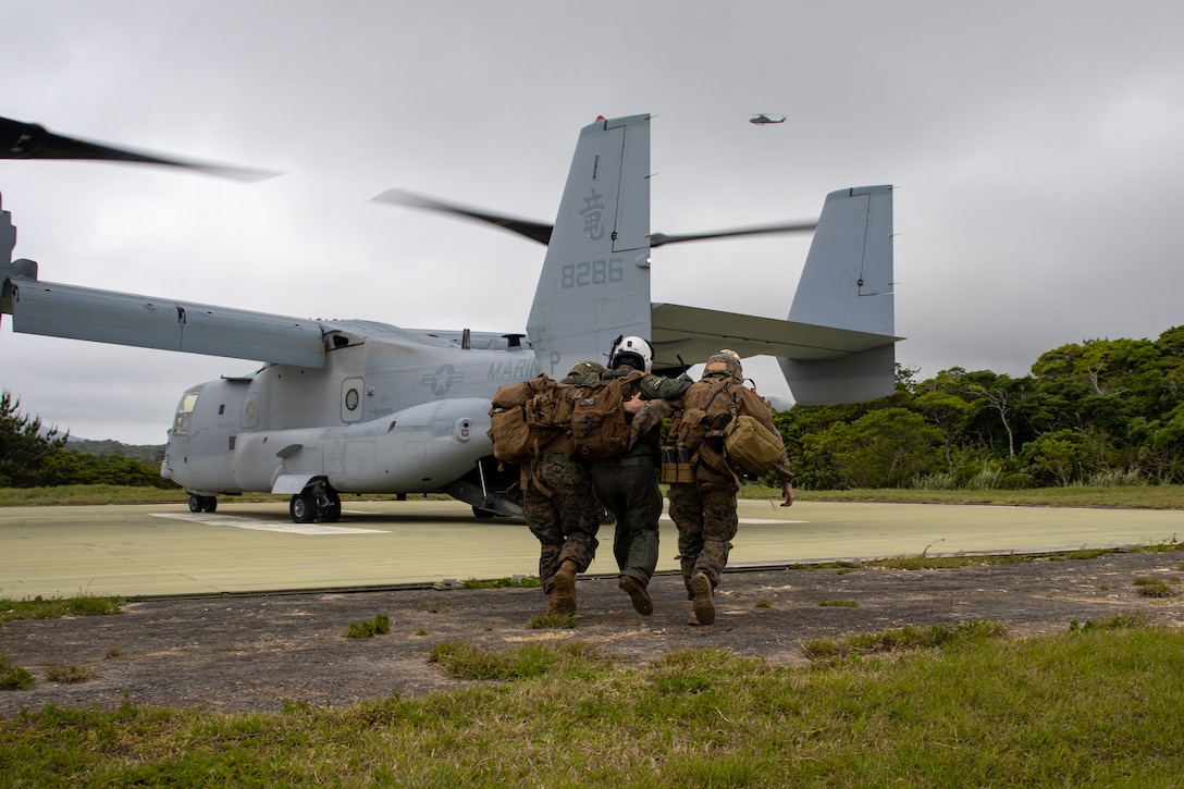U.S. Marines with Weapons Company, Battalion Landing Team 1st Battalion, 7th Marine Regiment, 31st Marine Expeditionary Unit, recovers a simulated casualty during tactical recovery of aircraft and personnel training as a part of MEU Exercise at Camp Hansen, Okinawa, Japan, May 1, 2025. The TRAP exercise showcased advanced trauma life support capabilities and evaluated the platoon’s rapid response and recovery tactics of downed aircraft, personnel and equipment in isolated locations. The 31st MEU, the Marine Corps' only continuously forward-deployed MEU, provides a flexible force ready to perform a wide-range of military operations across the Indo-Pacific region. (U.S. Marine Corps photo by Sgt. Peter Rawlins)
