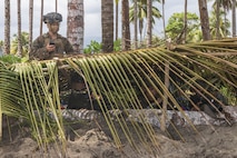 U.S. Marine Corps Cpl. Adam Clyne, an assistant patrol leader with 2nd Battalion, 1st Marine Regiment, Marine Rotational Force – Darwin 25.3, assists Philippine Marines with 3rd Marine Brigade, Philippine Marine Corps, as a personnel safety officer during a counter-landing live-fire rehearsal in support of Exercise Balikatan 25 at Rizal, Palawan, Philippines, April 27, 2025.