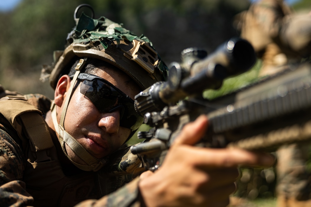 U.S. Marine Corps Cpl. Ivan Huerta, a native of Texas and an intelligence specialist with 3d Littoral Combat Team, 3d Marine Littoral Regiment, 3d Marine Division, sets security while participating in the Maritime Key Terrain Security Operations event during Exercise Balikatan 25 in the Batanes island chain, Philippines, April 24, 2025.