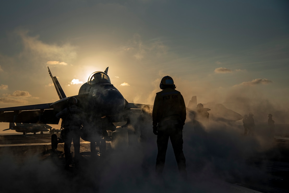 An F/A-18E Super Hornet from the “Mighty Shrikes” of Strike Fighter Squadron (VFA) 94 is guided onto the catapult on the flight deck of the aircraft carrier USS Nimitz (CVN 68) in the Philippine Sea, April 30, 2025.