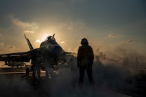 An F/A-18E Super Hornet from the “Mighty Shrikes” of Strike Fighter Squadron (VFA) 94 is guided onto the catapult on the flight deck of the aircraft carrier USS Nimitz (CVN 68) in the Philippine Sea, April 30, 2025.