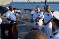 U.S. Navy Cmdr. James Koffi, commanding officer of the Arleigh Burke-class guided-missile destroyer USS Truxtun (DDG 103), left, speaks at a reception with Egyptian Navy Vice Adm. Ashraf Ibrahim Atwa Megahed, commander of the Egyptian Navy, right, in the U.S. Central Command area of responsibility.