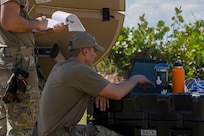 U.S. Air Force Master Sgt. Jose Rodriguez, the radio frequency non-commissioned officer in charge with the 156th Combat Communications Squadron, Puerto Rico Air National Guard, sets-up an Airbus 2.4 antenna, during a Full Operating Capability (FOC) evaluation at Punta Salinas Air National Guard Station, Toa Baja, Puerto Rico, April 24, 2025. A team of approximately 25 Airmen assigned to the 156th CBCS were evaluated on their level of proficiency in providing NIPR, SIPR, and VOIP services in an expeditionary setting as part of the FOC certification process. (U.S. Air National Guard photo by Senior Airman Victoria Jewett)