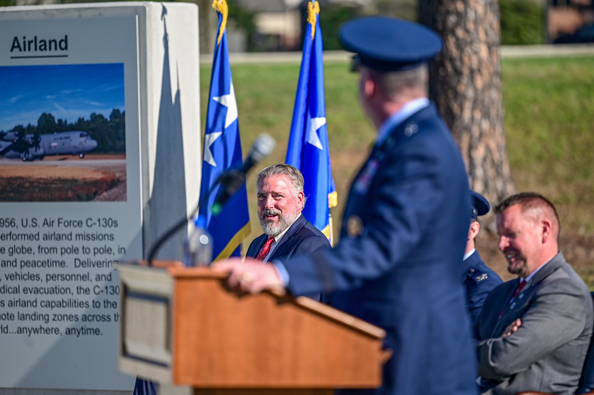 An Airman speaks to the crowd.