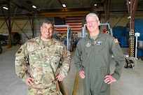 Col. Rick Kuehn, 512th Airlift Wing deputy wing commander, and Chief Master Sgt. Geoffrey Morales, 512th AW senior leader, pose for a photo during a tour of the maintenance on a C-5M Super Galaxy at the 433rd AW on Joint Base San Antonio-Lackland, Texas April 25, 2025.