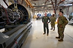 Lt. Col. Brandon Rodts, 433rd Maintenance Group deputy commander, shows Col. Rick Kuehn, 512th Airlift Wing deputy wing commander, a C-5M Super Galaxy engine being serviced during a tour of the maintenance facilities at the 433rd AW on Joint Base San Antonio-Lackland, Texas April 25, 2025. The 512th AW leadership from Dover Air Force Base visited to learn about the capabilities and operations of the 433rd AW and to visit their maintainers working alongside 433rd AW counterparts. (U.S. Air Force photo by Master Sgt. Jacob Lewis)