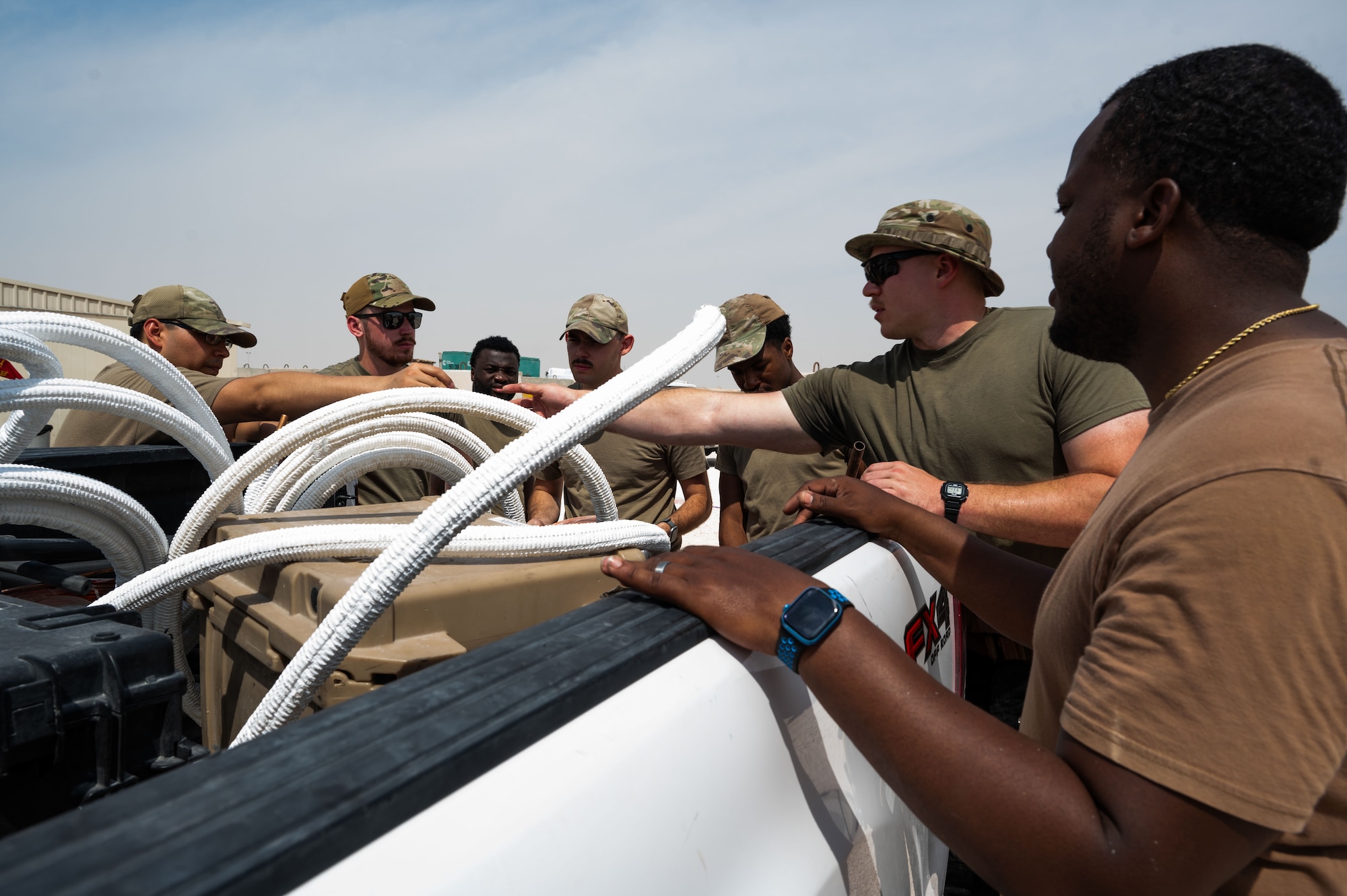 U.S. Airmen assigned to the 379th Expeditionary Civil Engineer Squadron distribute materials for air conditioning installations within the U.S. Central Command area of responsibility, April 26, 2025. The Heating Ventilation and Air Conditioning shop is responsible for installing, maintaining and repairing air conditioning units that are essential for maintaining proper equipment temperatures and ensuring personnel safety. (U.S. Air Force photo by Senior Airman Dieondiere Jefferies)
