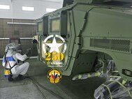 Fabian Vanhaecht sprays a Humvee with olive drab green paint at the Logistics Readiness Center Benelux paint booth. Since August, Vanhaecht has worked there as an autobody technician. “When I applied for this job last year, I didn’t know the Army would be celebrating its 250th birthday in 2025. Now that I know this, I’m happy to be a part of the team on this special year. Happy 250th birthday, U.S. Army!” he said. (Photo by Giancarlo Giardina)