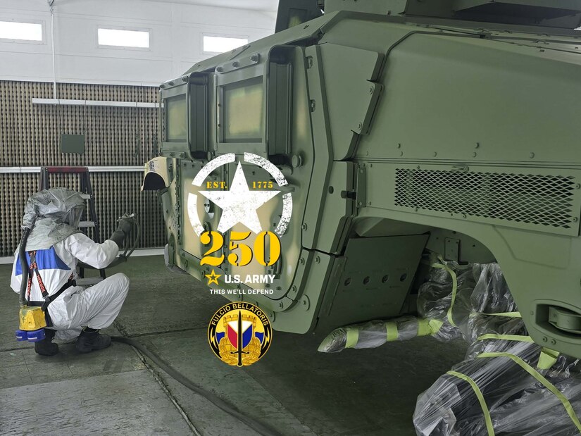 Fabian Vanhaecht sprays a Humvee with olive drab green paint at the Logistics Readiness Center Benelux paint booth. Since August, Vanhaecht has worked there as an autobody technician. “When I applied for this job last year, I didn’t know the Army would be celebrating its 250th birthday in 2025. Now that I know this, I’m happy to be a part of the team on this special year. Happy 250th birthday, U.S. Army!” he said. (Photo by Giancarlo Giardina)