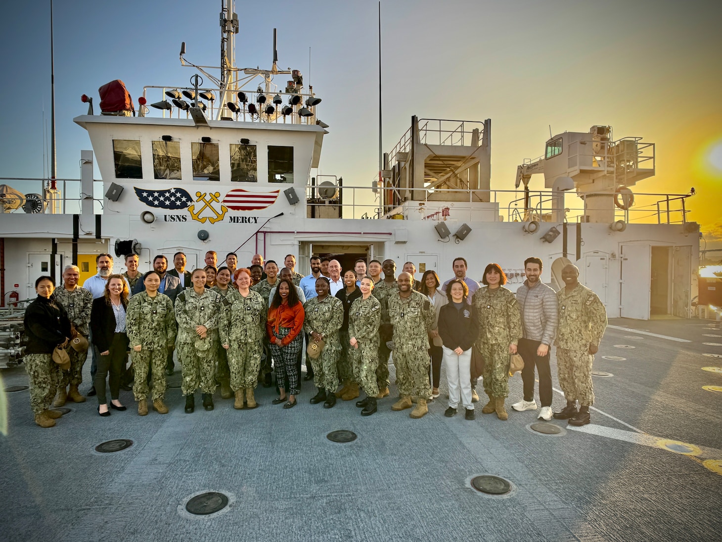 250502-N-N1505-1002 SAN DIEGO (May 1, 2025) American College of Healthcare Executives (ACHE) guests pose for a group photo aboard the hospital ship USNS Mercy (T-AH 19) during an educational tour exploring military medicine and global health, May 1, 2025. The event, hosted in partnership with Naval Medical Center San Diego and USNS Mercy leadership, offered attendees insight into the Navy’s forward-deployed medical capabilities and provided 1.5 in-person ACHE education credits. The mission of NMCSD is to provide a superior experience for our patients, staff, and warfighters. NMCSD employs more than 5,000 active-duty military personnel, civilians, and contractors in southern California to deliver exceptional care afloat and ashore.