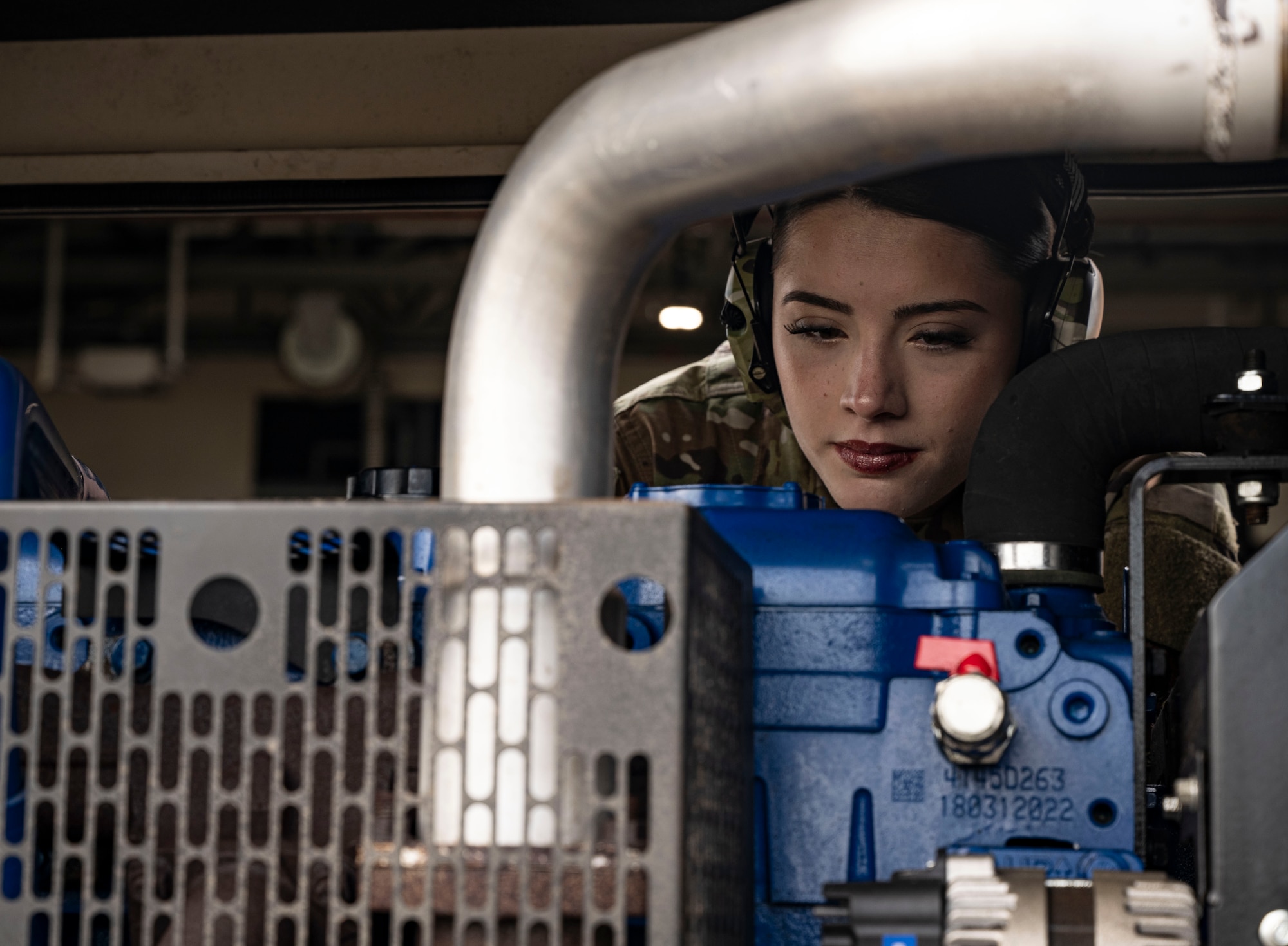 U.S. Air Force Airman 1st Class Gracie Gary, 100th Civil Engineer Squadron power production journeyman, inspects a generator as the ignition starts at RAF Mildenhall, England, May 2, 2025