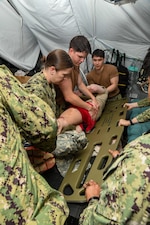 ailors transfer a simulated casualty from a litter during the Expeditionary Medical Facility Kilo (EMF-Kilo) Operational Readiness Exercise (ORE) on Fort McCoy, Wisconsin, April 30, 2025. EMF-Kilo is the readiness platform attached to Navy Medicine Readiness and Training Command Camp Lejeune and is comprised of approximately 400 personnel ready to deploy field hospital capabilities during humanitarian or combat mission.