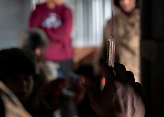U.S. Navy Chief Hospital Corpsman Uche Nzegwu, assigned to the Nimitz-class aircraft carrier USS George Washington (CVN 73), prepares a needle during a tactical combat casualty care training exercise at Yokota Air Base, Japan, April 3, 2025. The training scenarios were tailored to the three phases of tactical combat casualty care: care under fire, tactical field care and tactical evacuation care. (U.S. Air Force photo by Senior Airman Samantha White)