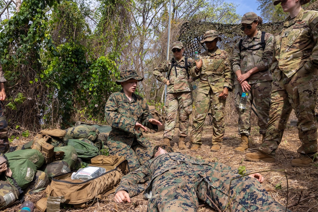 250430-M-KI947-2450 U.S. Navy Hospital Corpsman 3rd Class Hailey Lisska, left, assigned to Lima Company, 3rd Battalion, 25th Marine Regiment, instructs a course on tactical combat casualty care for members of the U.S. Air Force, Trinidad and Tobago Defence Force, and the French Army at Teteron Barracks in Teteron Bay, Trinidad and Tobago during TRADEWINDS 25 (TW25) April 30, 2025. TW25 is a U.S. Southern Command-sponsored, Chairman of the Joint Chiefs of Staff-approved annual exercise that enhances regional stability and demonstrates U.S. joint force coordination and interoperability with allies and partners. (U.S. Marine Corps photo by Lance Cpl. Payton Goodrich)
