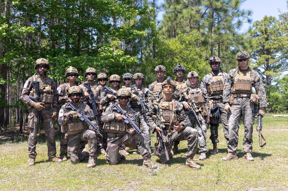 U.S. Marines with Golf Company, 2nd Battalion, 2nd Marine Regiment pose for a photo with French Marines from the 13th Foreign Legion Demi Brigade during Exercise Chesapeake 25 at Marine Corps Base Camp Lejeune, North Carolina, May 1, 2025. Exercise Chesapeake 2025 was a bilateral U.S.–French naval exercise that underscored a commitment to interoperability, maritime readiness, and shared values. The exercise took place as the U.S. Marine Corps is celebrating 250 years of warfighting excellence and reflects the Marine Corps’ commitment to global partnerships and naval integration, enabling the force to rapidly respond to crises, deter adversaries, and reassure allies. (U.S. Marine Corps Photo by Lance Cpl. Jack Labrador)