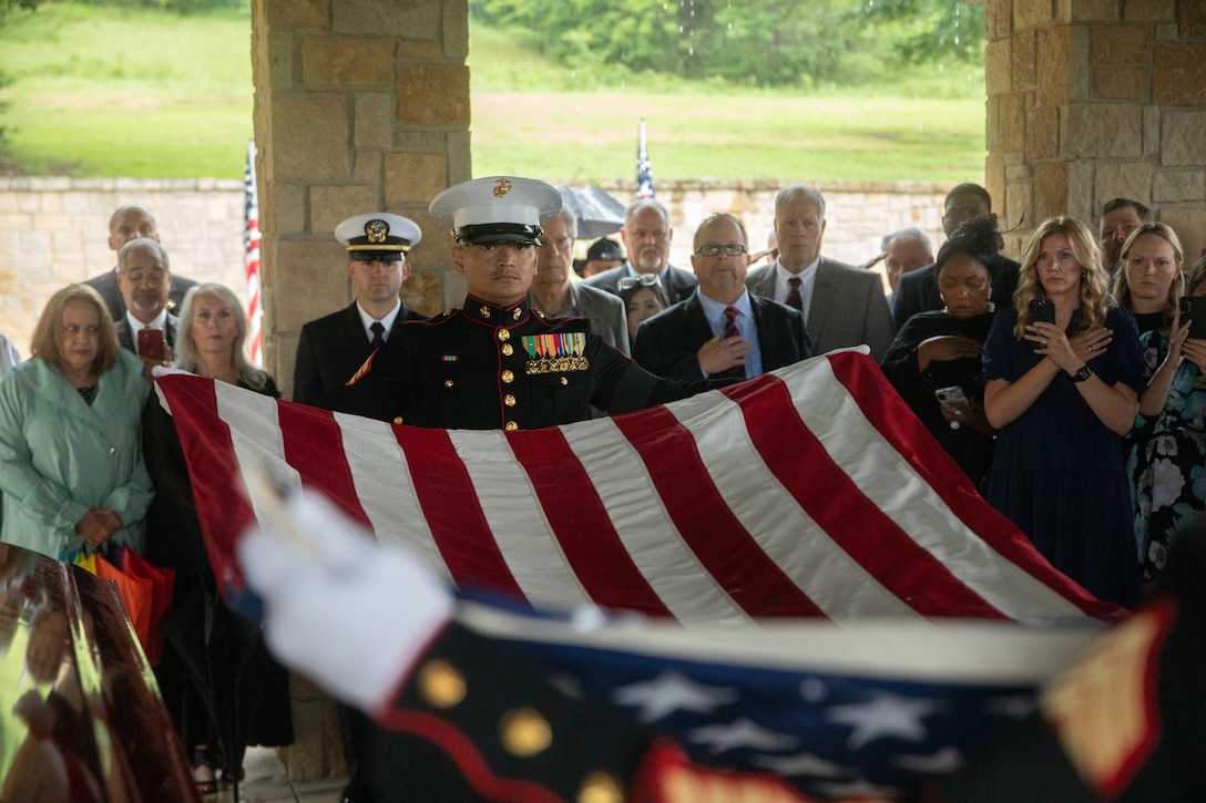U.S. Marine Gunnery Sgt. Daniel Sok, an aviation ordnance chief, with Marine Aircraft Group-41 begins to fold the flag at the funeral of retired Lt. Gen. Richard E. Carey at Dallas-Fort Worth National Cemetery in Dallas, Texas, May 5, 2025. 



Carey served 38 years in the Marine Corps, serving in both the Korean and Vietnam War. Near the end of his service, Carey led the efforts of Operation Frequent Wind, the final phase in evacuation of American Forces from Saigon City, Vietnam, marking the end of U.S. involvement in the Vietnam War. After his service, Carey continued to help serve his community in different ways, such as participating in the creation of a national monument honoring those who served in the Battle of the Chosin Reservoir and assisting in the construction of the Dallas-Fort Worth National Cemetery. (U.S. Marine Corps photo by Cpl. Isaiah W. Smith)