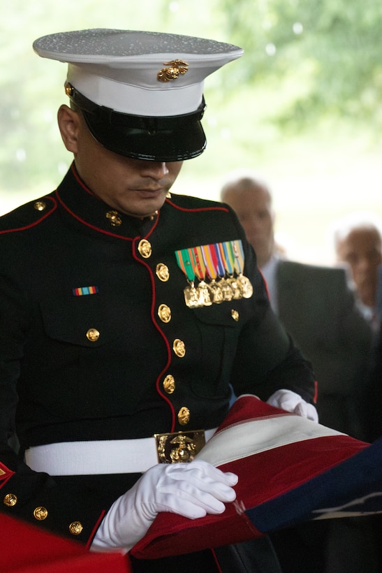 U.S. Marine Gunnery Sgt. Daniel Sok, Aviation Ordnance Chief, with Marine Aircraft Group-41 folds the flag at the funeral of retired Lt. Gen. Richard E. Carey at Dallas-Fort Worth National Cemetery in Dallas, Texas, May 5, 2025. 



Carey served 38 years in the Marine Corps, serving in both the Korean and Vietnam War. Near the end of his service, Carey led the efforts of Operation Frequent Wind, the final phase in evacuation of American Forces from Saigon City, Vietnam, marking the end of U.S. involvement in the Vietnam War. After his service, Carey continued to help serve his community in different ways, such as participating in the creation of a national monument honoring those who served in the Battle of the Chosin Reservoir and assisting in the construction of the Dallas-Fort Worth National Cemetery. (U.S. Marine Corps photo by Cpl. Isaiah W. Smith)