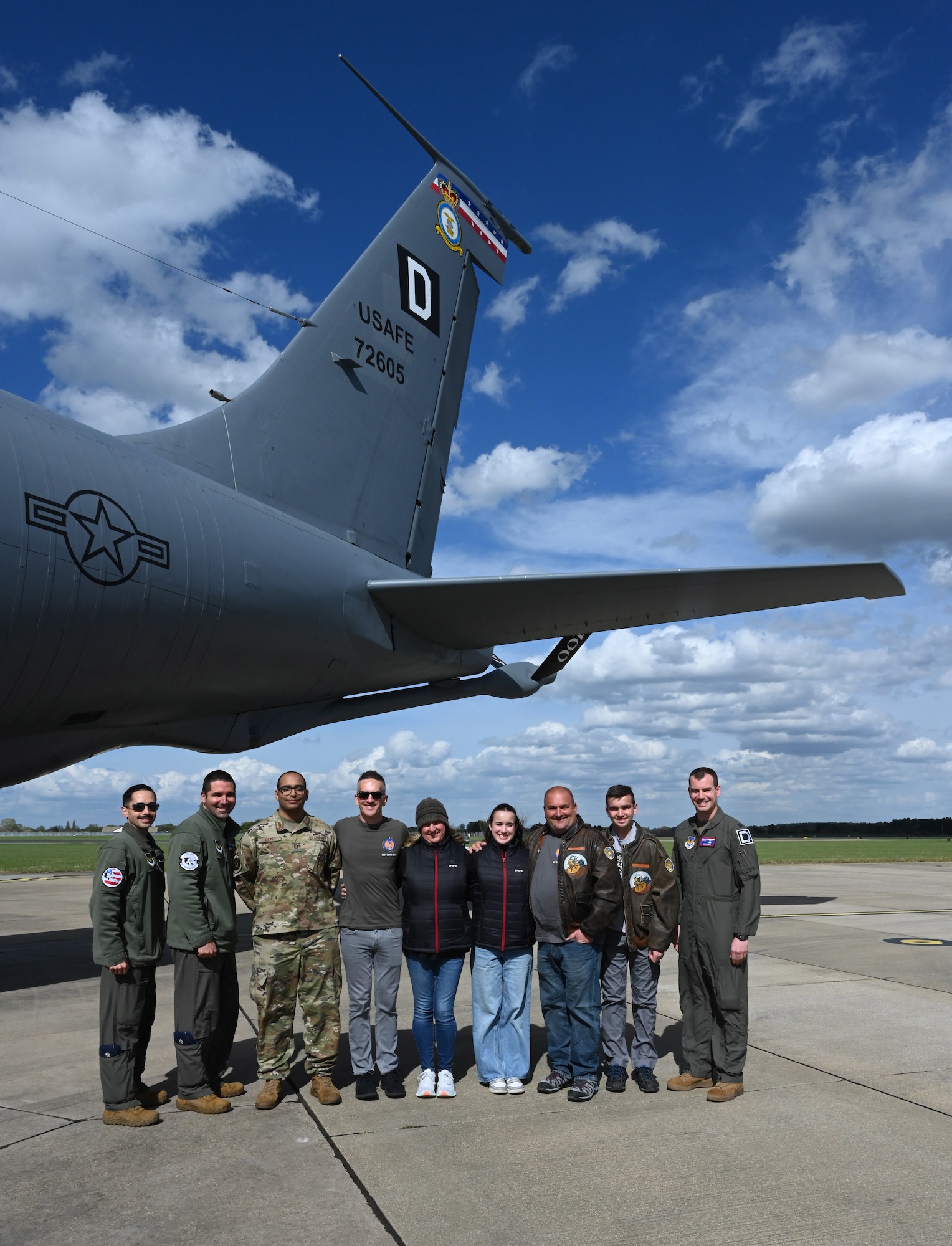 U.S. Air Force leadership and Airmen from the 100th Air Refueling Wing show a KC-135 Stratotanker bearing the “Wolff Pack” nose art to family members of U.S. Army Air Corps Capt. Robert “Bob” Wolff, World War II and 100th Bomb Group veteran, at RAF Mildenhall, England, April 16, 2025. Wolff was a B-17 Flying Fortress pilot. He and his crew were nicknamed the “Wolff Pack,” as was their aircraft they flew several missions in. The KC-135 is one of the 100th ARW’s fleet of aircraft bearing legacy nose art. (U.S. Air Force photo by Karen Abeyasekere)