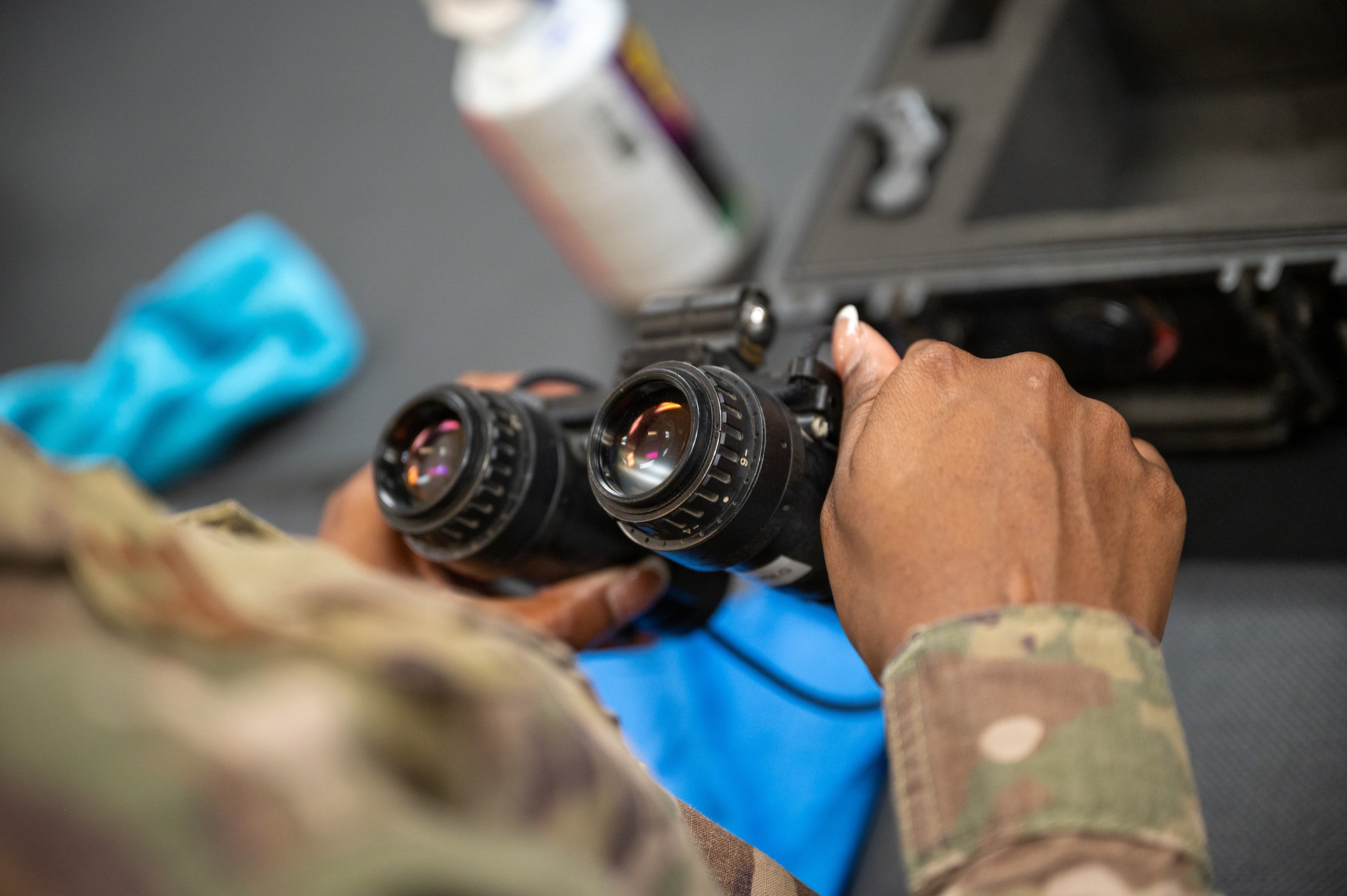 An Aircrew Flight Equipment technician inspects a pair of night vision goggles at Hurlburt Field.