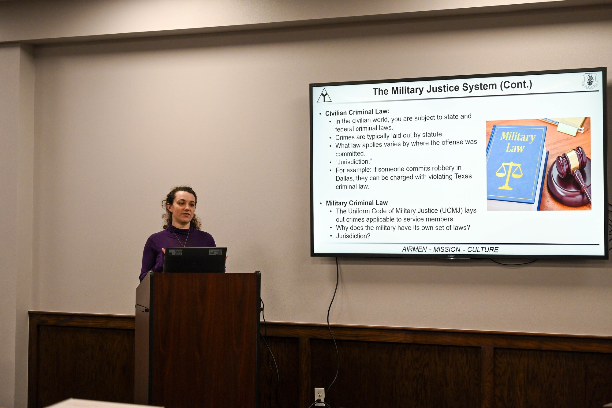 Rachel Whalen, 97th Air Mobility Wing Judge Advocate flight attorney advisor, gives a briefing during Law Week at Altus Air Force Base, Oklahoma, May 2, 2025. The week began with a workshop for senior non-commissioned officers to learn how to guide their Airmen on available legal resources. (U.S. Air Force photo by Airman 1st Class Lauren Torres)