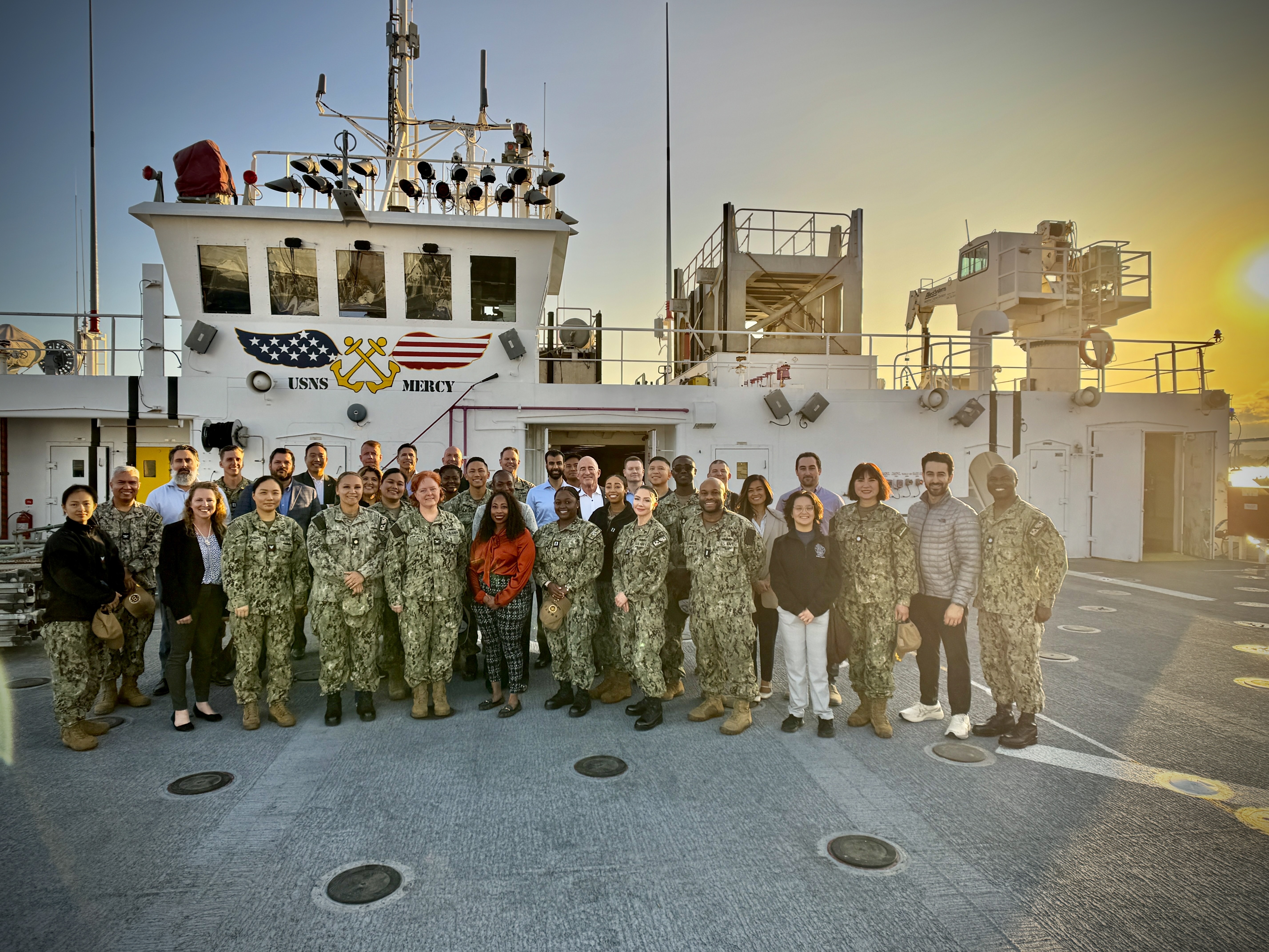 250502-N-N1505-1002 SAN DIEGO (May 1, 2025) American College of Healthcare Executives (ACHE) guests pose for a group photo aboard the hospital ship USNS Mercy (T-AH 19) during an educational tour exploring military medicine and global health, May 1, 2025. The event, hosted in partnership with Naval Medical Center San Diego and USNS Mercy leadership, offered attendees insight into the Navy’s forward-deployed medical capabilities and provided 1.5 in-person ACHE education credits. The mission of NMCSD is to provide a superior experience for our patients, staff, and warfighters. NMCSD employs more than 5,000 active-duty military personnel, civilians, and contractors in southern California to deliver exceptional care afloat and ashore.