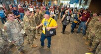 Pete Pringle, a leader with Honor Flight of Oregon, shakes hands with Sgt. 1st Class Jase Deemer, Headquarters and Headquarters Company Readiness NCO, 1st Battalion, 186th Infantry Regiment, at the Medford Airport, Medford, Ore., May 4, 2025. Sgt. 1st Class Deemer coordinated the Oregon Army National Guard support for the veteran welcome event, which honored veterans returning from visiting military memorials in Washington, D.C.