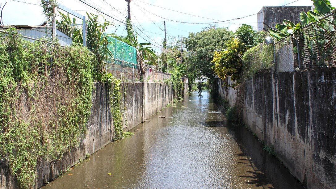Homes built right next to concrete channel walls.