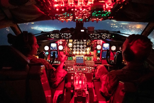 U.S. Air Force Capt. Katleen Ybarra, and 1st Lt. Logan Pethtel, 91st Expeditionary Air Refueling Squadron KC-135 Stratotanker pilots fly during a combat aerial refueling mission within the U.S. Central Command area of responsibility, Dec. 30, 2022.