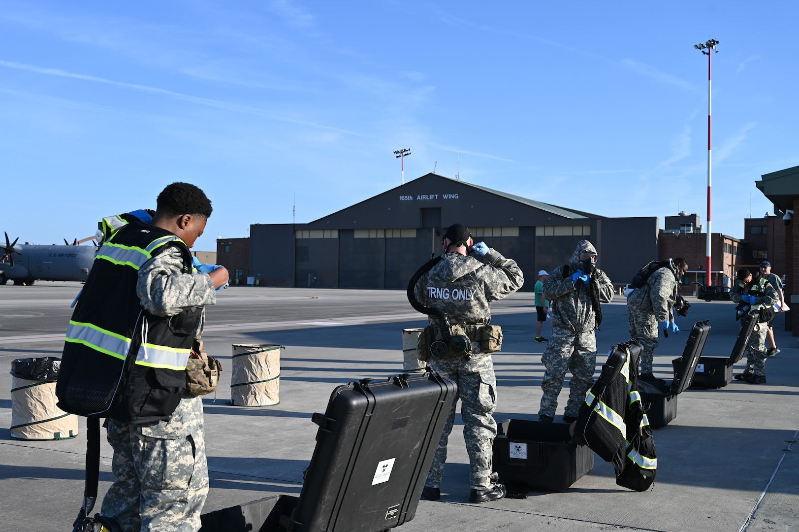 U.S. Army chemical, biological, radiological, and nuclear (CBRN) specialists assigned to the chemical, biological, radiological, nuclear, explosives (CBRNE) Team 3 from the 25th CBRNE Company (Technical Escort), conduct CBRN decontamination procedures during exercise Toxic Peach at the 165th Airlift Wing, Savannah Air National Guard Base, Georgia, April 30, 2025.