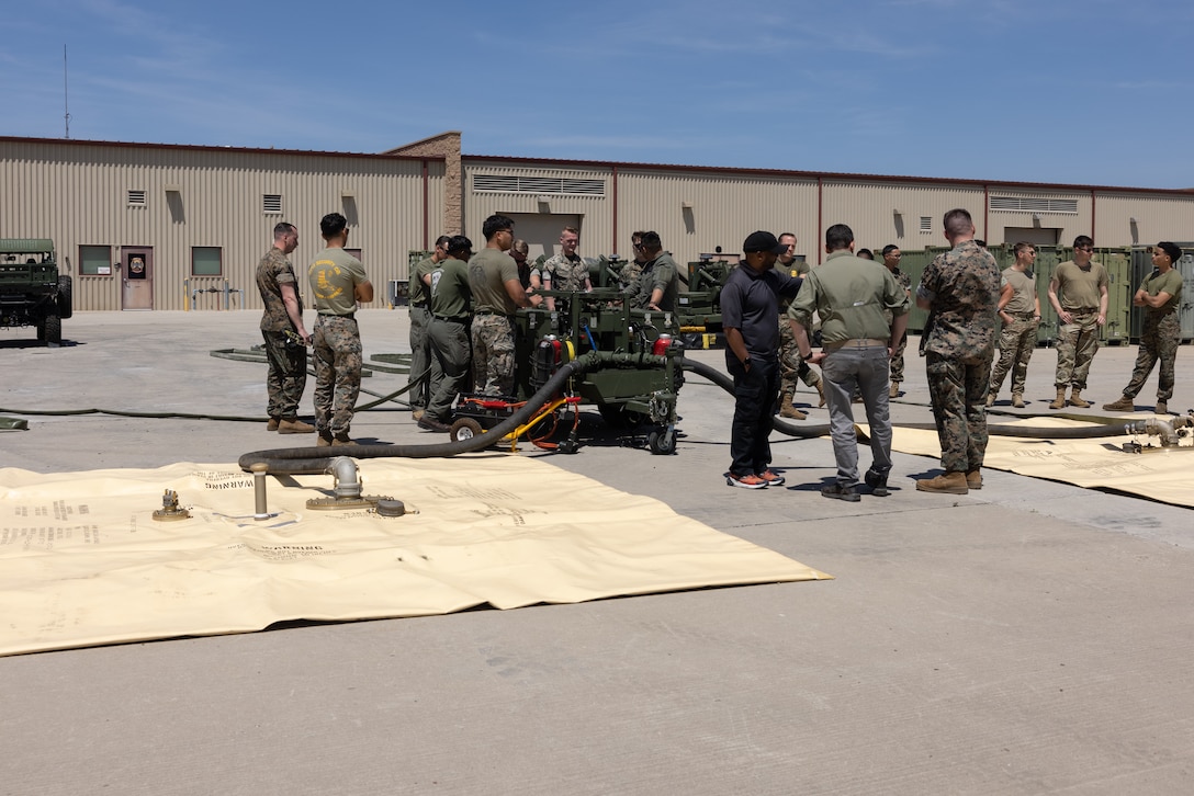 U.S. Marines and U.S. Airmen from the 27th Special Operations Mission Support Group, set up fueling equipment during Tactical Air-Ground Refueling System New Equipment Training at Marine Corps Air Station Miramar, California, April 24, 2025.  The TAGRS, an expeditionary Marine Corps-exclusive asset, is a compact mobile refueling system designed to expand the capabilities of Marine Corps’ Forward Arming and Refueling Points and Expeditionary Advanced Base Operations. TAGRS support refueling operations in forward areas and remote locations. (U.S. Marine Corps photo by Lance Cpl. Samantha Devine)