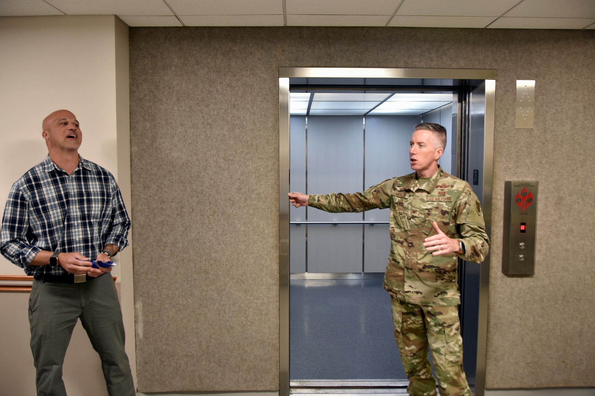 Col. Grant Mizell, Arnold Engineering Development Complex commander, right, speaks following a ribbon cutting for the new elevator in the Administration and Engineering Building at Arnold Air Force Base, Tenn., May 5, 2025. Arnold AFB is the headquarters of AEDC. Also pictured is Project Manager Joseph Baxter. The process of replacing the elevator was a two-year effort overseen by the AEDC Civil Engineering Branch. The previous elevator had been in place since construction of the building and was originally intended to serve as a cargo elevator. (U.S. Air Force photo by Bradley Hicks)