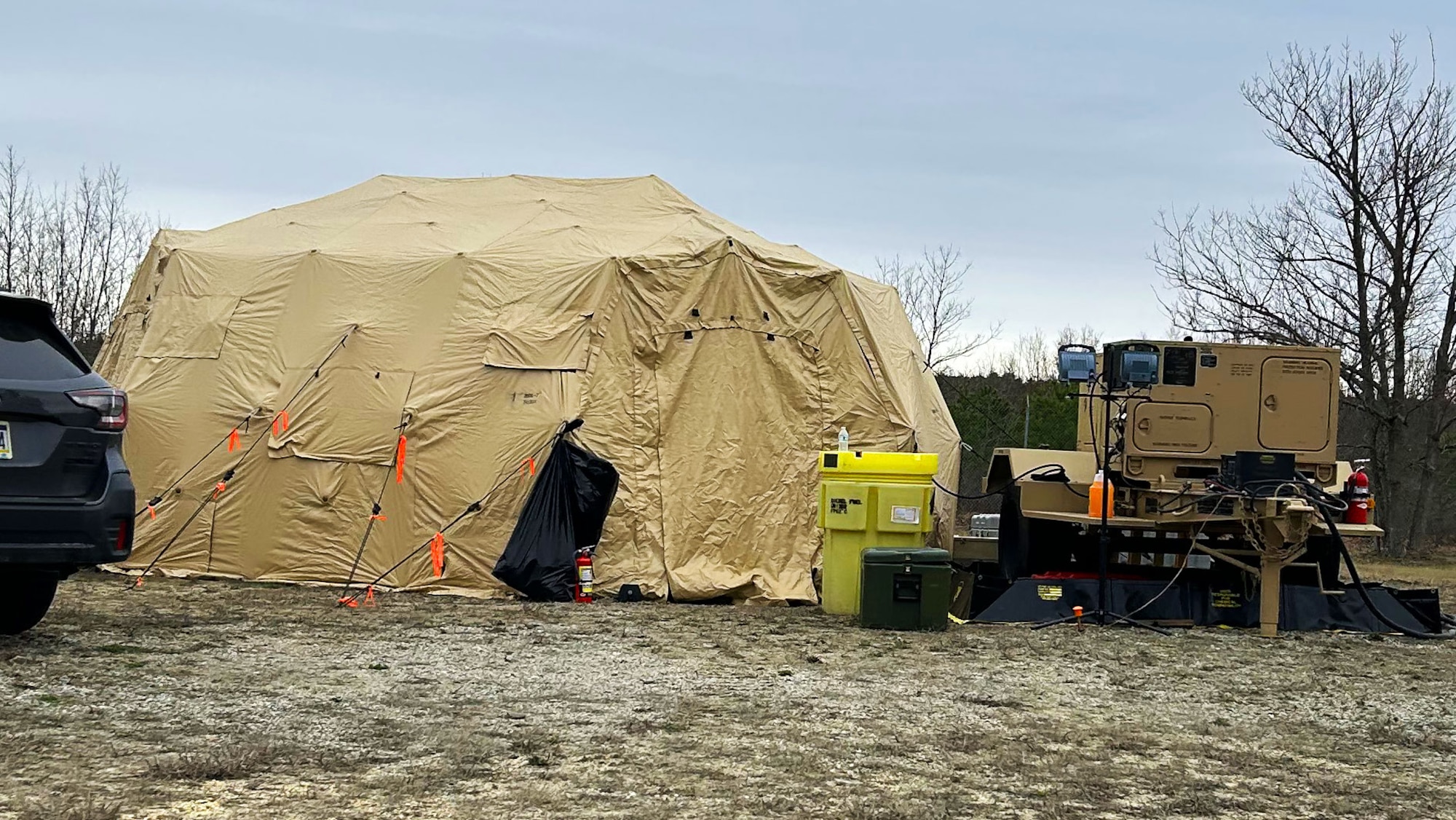 A team from the 258th Combat Airfield Operations Squadron use expeditionary sleeping quarters ahead of the delivery of the Mobile Special Navigational Aid-7 tower to reduce operational costs at Lakehurst’s Maxwell Field at Joint Base McGuire-Dix-Lakehurst, N.J., April 4, 2025. In a display of Total Force Integration, active-duty Airmen, Sailors and Air National Guard teams successfully deployed and activated the MSN-7 tower at Lakehurst’s Maxwell Field while the main tower underwent refurbishment allowing for uninterrupted support to mission readiness and operational capability. (U.S. Navy photo by Electronics Technician 1st Class Dariel Cruz)