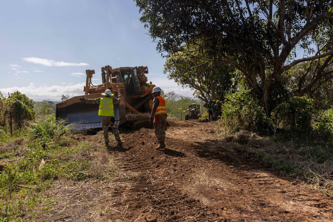 Philippine Army soldiers assigned to the 522nd Construction Battalion, 51st Brigade, and U.S. Army Soldiers assigned to the 84th Engineer Battalion, 130th Engineer Brigade, 8th Theater Sustainment Command, improve road during Salaknib 2025, at Fort Magsaysay, Philippines, on March 24, 2025.