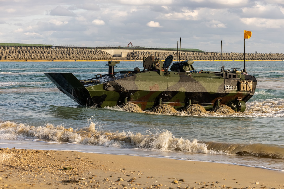 Marines operate an amphibious vehicle in the water