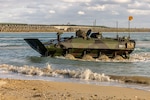 Marines operate an amphibious vehicle in the water