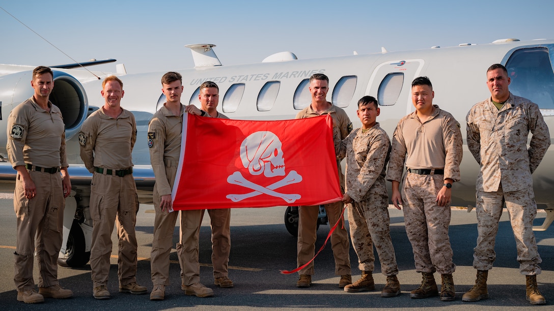 U.S. Marines assigned to the Marine Transport Squadron Detachment (VMR DET) Andrews pose for a group photo in front of a UC-35D Citation Encore within the U.S. Central Command area of responsibility, Oct. 22, 2024. VMR DET Andrews Marines transport high-ranking military officials and DoD personnel. (U.S. Air Force photo)