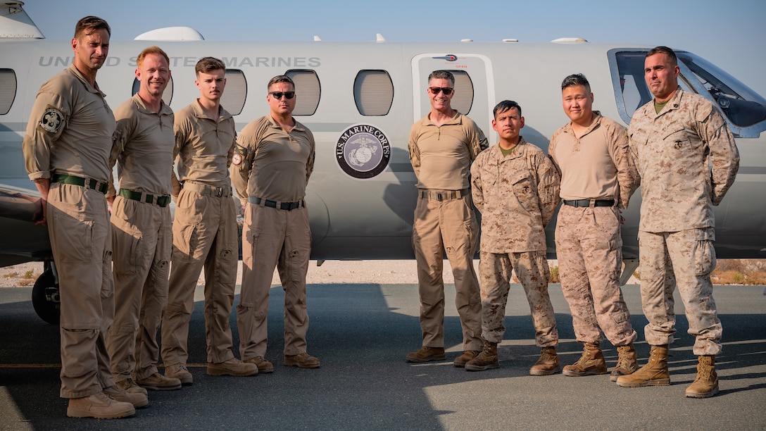 U.S. Marines assigned to the Marine Transport Squadron Detachment (VMR DET) Andrews pose for a group photo in front of a UC-35D Citation Encore within the U.S. Central Command area of responsibility, Oct. 22, 2024. The VMR DET Andrews mission involves providing timely and secure air transportation services for distinguished visitors. (U.S. Air Force photo)