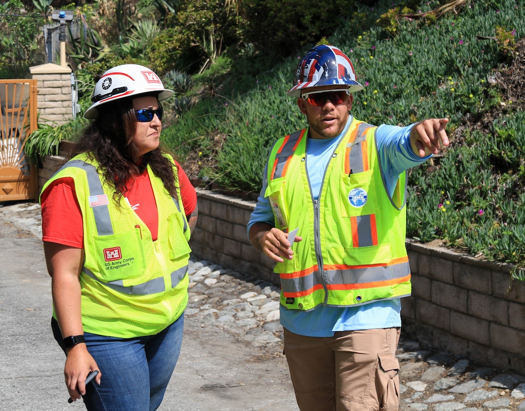 Quality Assurance Supervisor Tiffany Natvidad, Tulsa District employee, left, gathers information from an U.S. Army Corps of Engineers contractor in Altadena, California, April 14.  

USACE is working in partnership with local, state and the Federal Emergency Management Agency in response to the Southern California Wildfires.