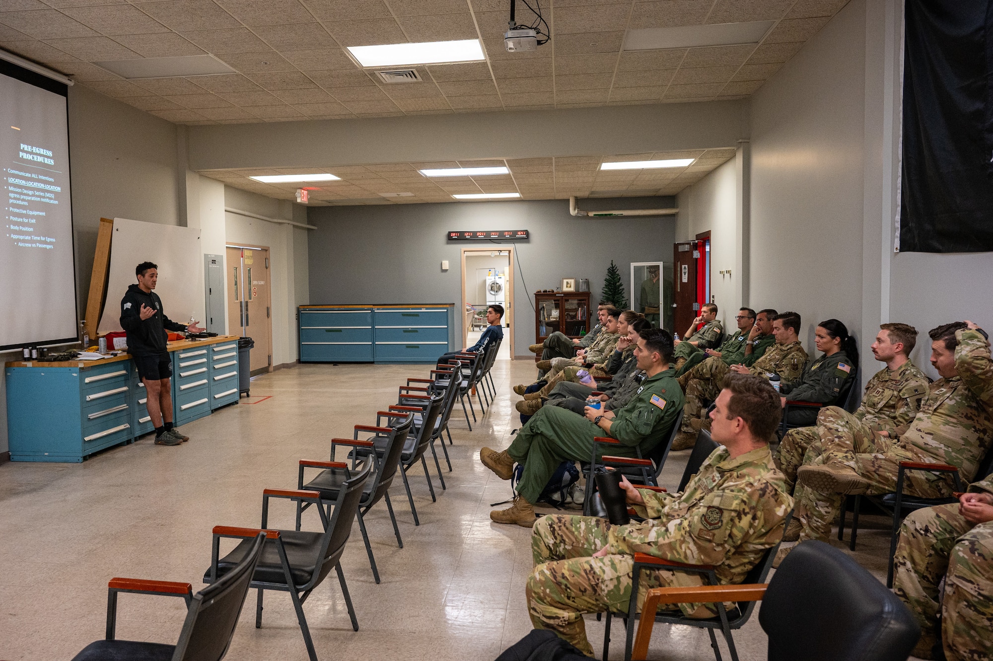 U.S. Air Force Staff Sgt. Christopher Maldonado, 436th Operational Support Squadron Survival, Evasion, Resistance and Escape specialist, discusses what to do in the final moments before a water landing during the Water Survival Preparation course at Dover Air Force Base, Delaware, April 29, 2025. During the classroom portion of the WSP course Airmen learned about the different emergency devices typically aboard an aircraft and ways to mitigate sun exposure and dehydration.