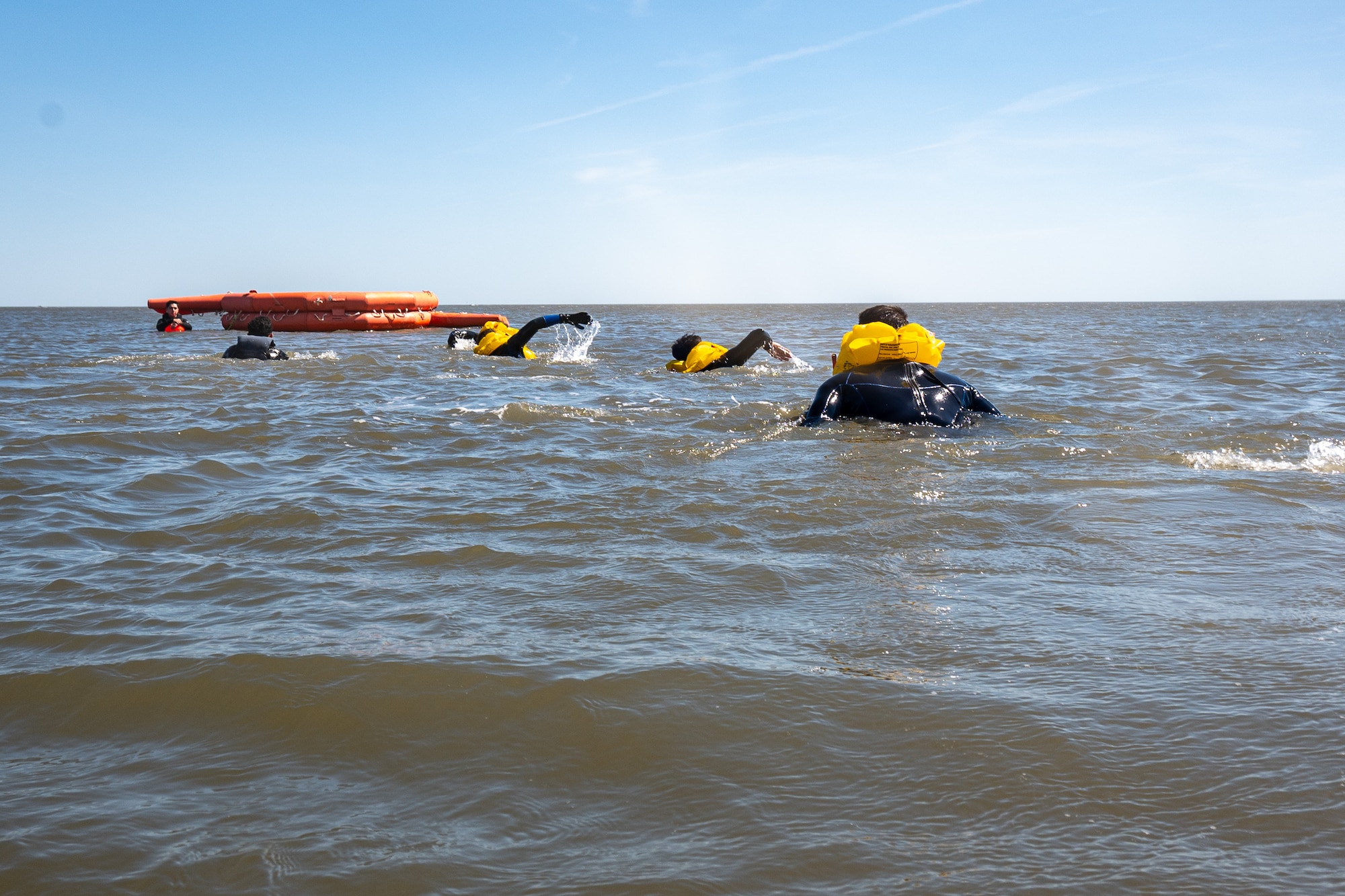 Team Dover Airmen swim to a 20-person life raft during their Water Survival Preparation course at Bowers Beach, Delaware, April 29, 2025. The Water Survival Preparation course reinforces Airmen’s knowledge and best practices for survival in the event of a downed aircraft over open water.