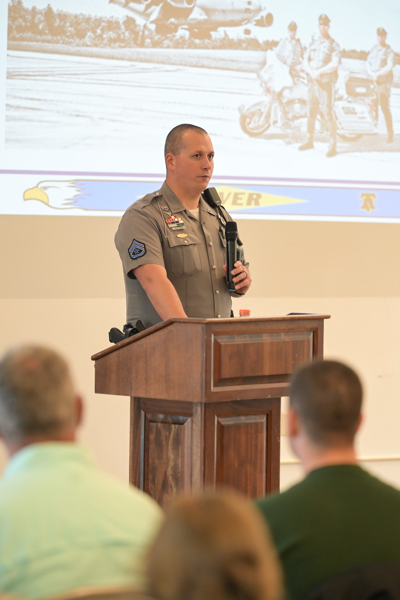 Master Corporal Tyler Loomis, Dover Police Department Motorcycle Unit section leader, gives a safety brief during the annual Motorcycle Safety Day at Dover Air Force Base, Delaware, May 2, 2025. The pre-season Motorcycle Safety briefing included guest speakers from Delaware Department of Motor Vehicles, Delaware State Police, City of Dover Motorcycle Patrol Unit, and the Dover AFB Green Knights Chapter 49 organization. (U.S. Air Force photo by Mauricio Campino)