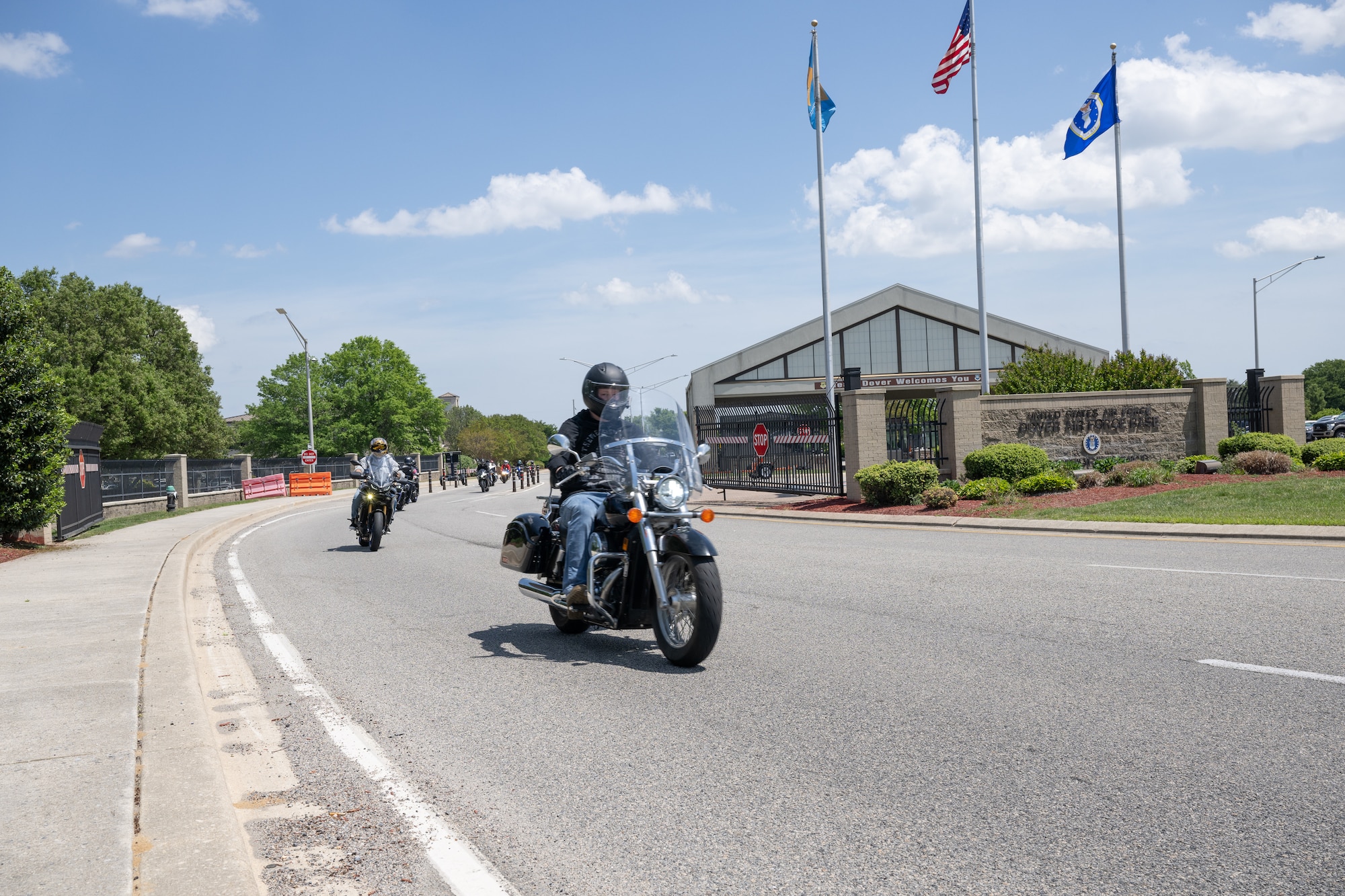 Riders depart on a mentorship ride at the conclusion of the annual Motorcycle Safety Day at Dover Air Force Base, Delaware, May 2, 2025. The event also featured pre-season safety briefs and motorcycle pre-ride inspections. (U.S. Air Force photo by Mauricio Campino)