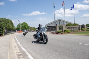 Riders depart on a mentorship ride at the conclusion of the annual Motorcycle Safety Day at Dover Air Force Base, Delaware, May 2, 2025. The event also featured pre-season safety briefs and motorcycle pre-ride inspections. (U.S. Air Force photo by Mauricio Campino)