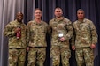 Sgt. 1st Class Denis Mulligan, third from left, Health Services and Support Branch Chief with the Pa. Guard’s G1 Services Division, was recently recognized as the Army National Guard medical readiness noncommissioned officer of the year for large states. The award is intended to recognize a medical readiness NCO who has demonstrated excellence in their position by contributing to high levels of medical readiness while serving. (U.S. Army National Guard courtesy photo)